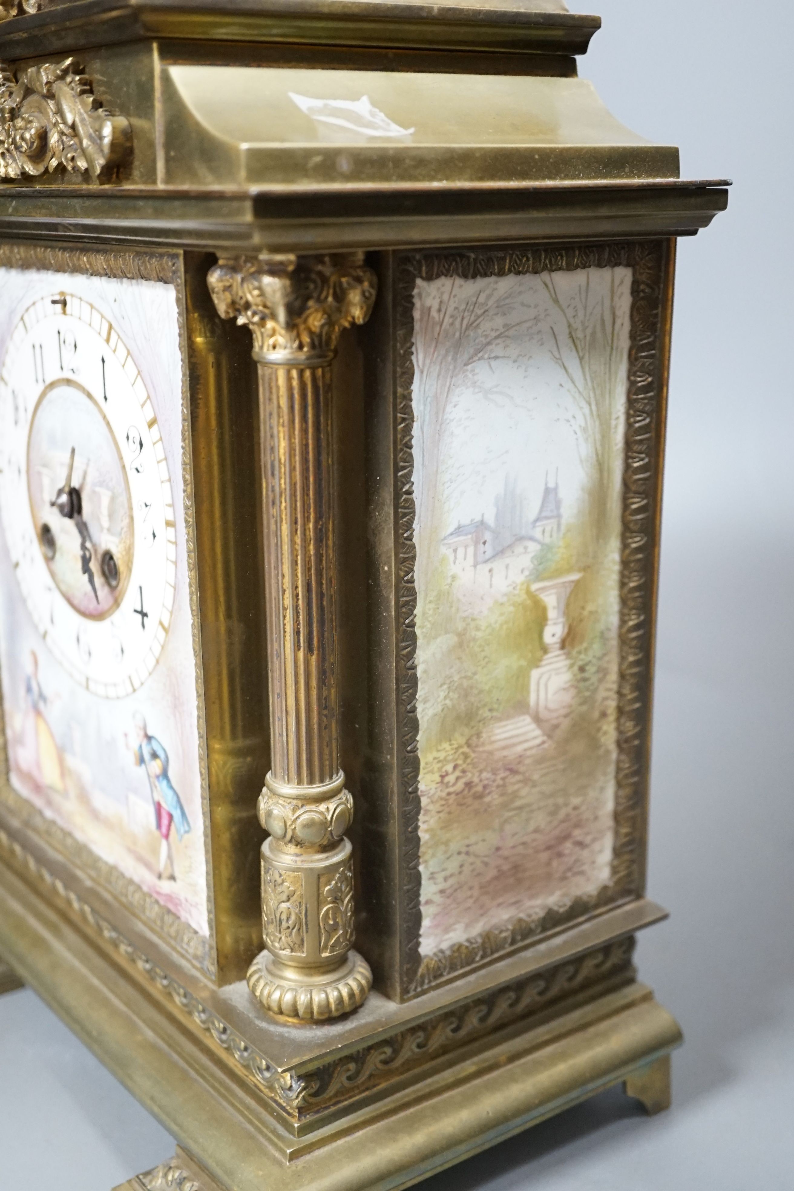 A French porcelain mounted brass mantel clock-31 cms high.